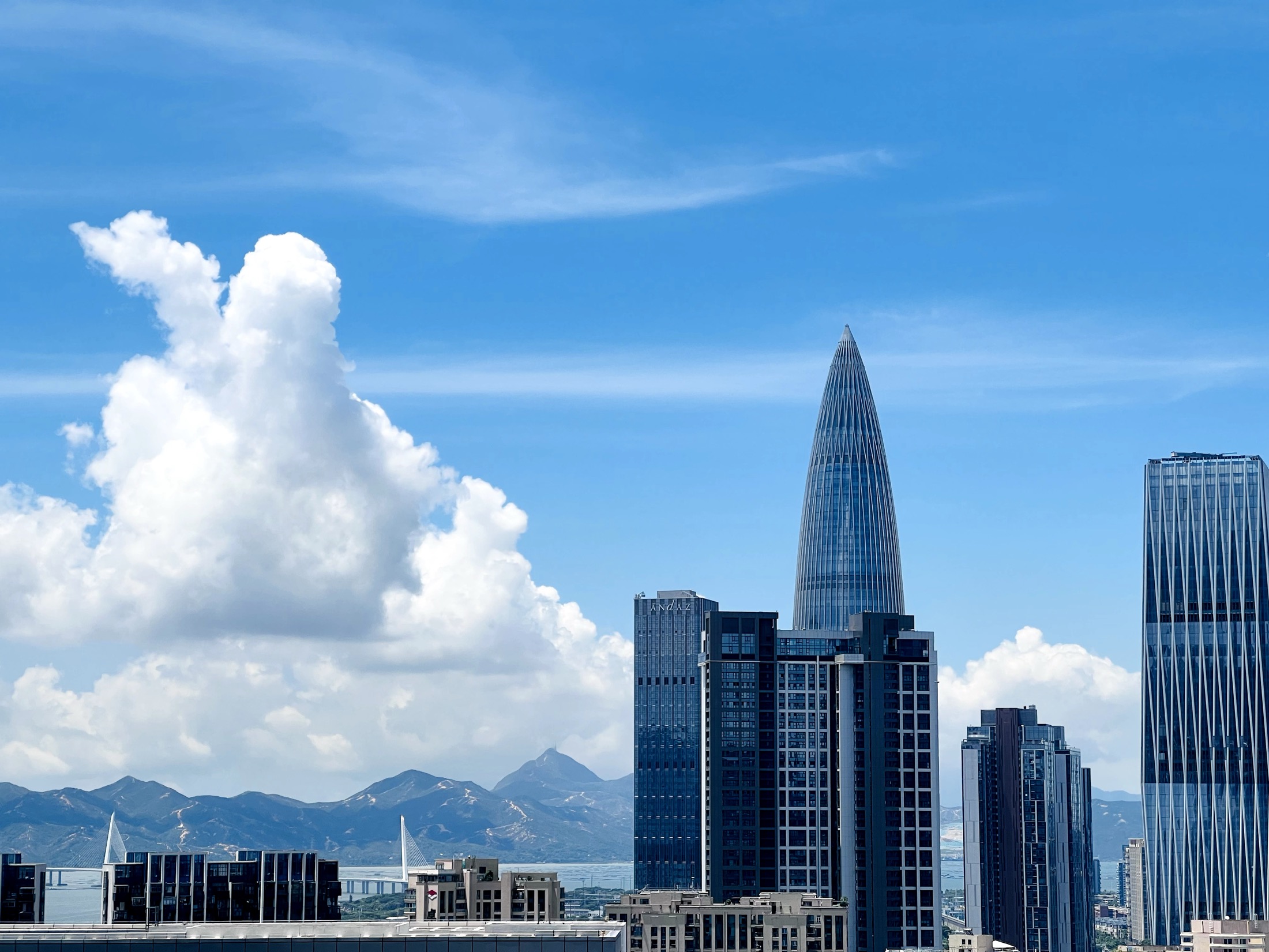 Shenzhen Bay skyline under a blue sky